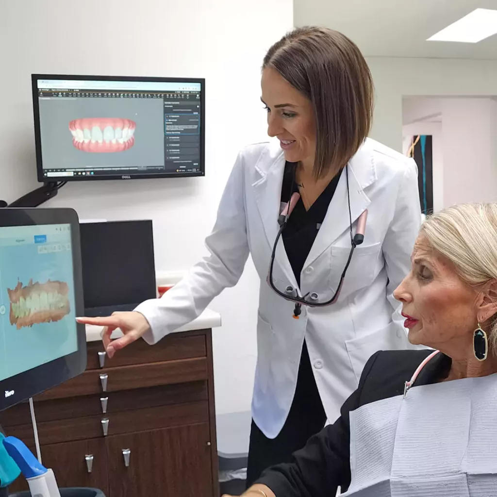 Dr. Traci Leon with a dental client.
